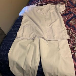 Two pairs of white scrubs, never worn.